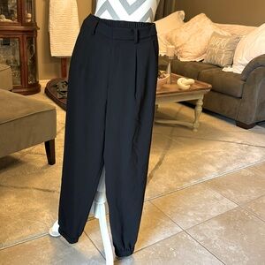 Black Uniglo pleated trousers with jogger style legs